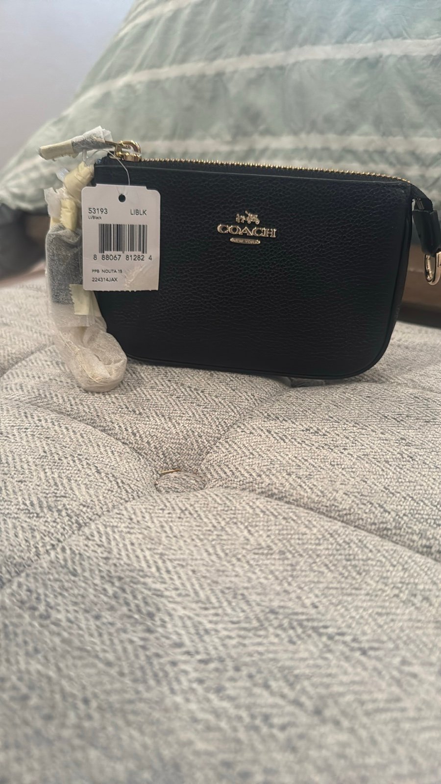 NWT, Coach black leather Nolita 15 wristlet .