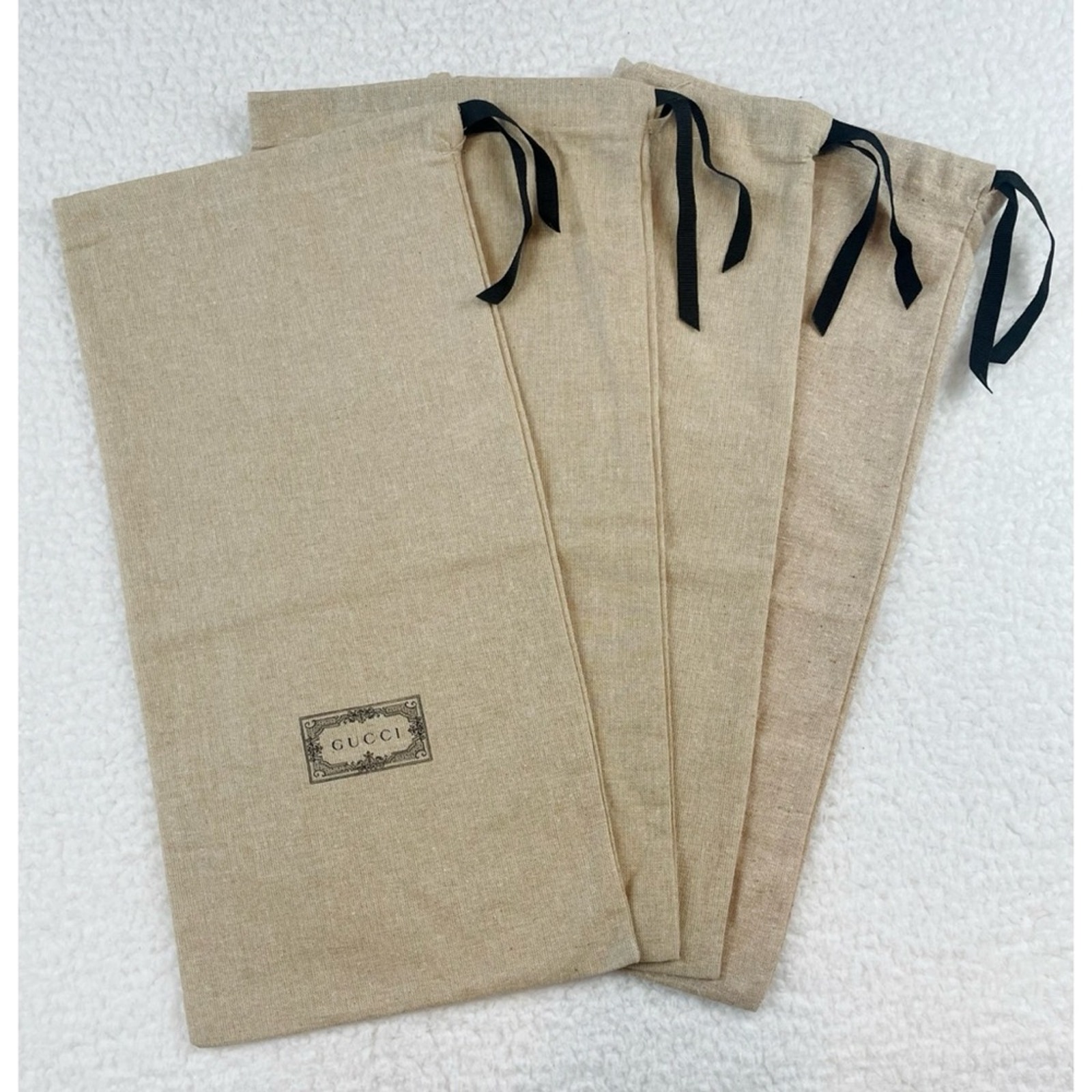 GUCCI • Set of 4 Tan Linen Small Logo Shoe Dust Bags