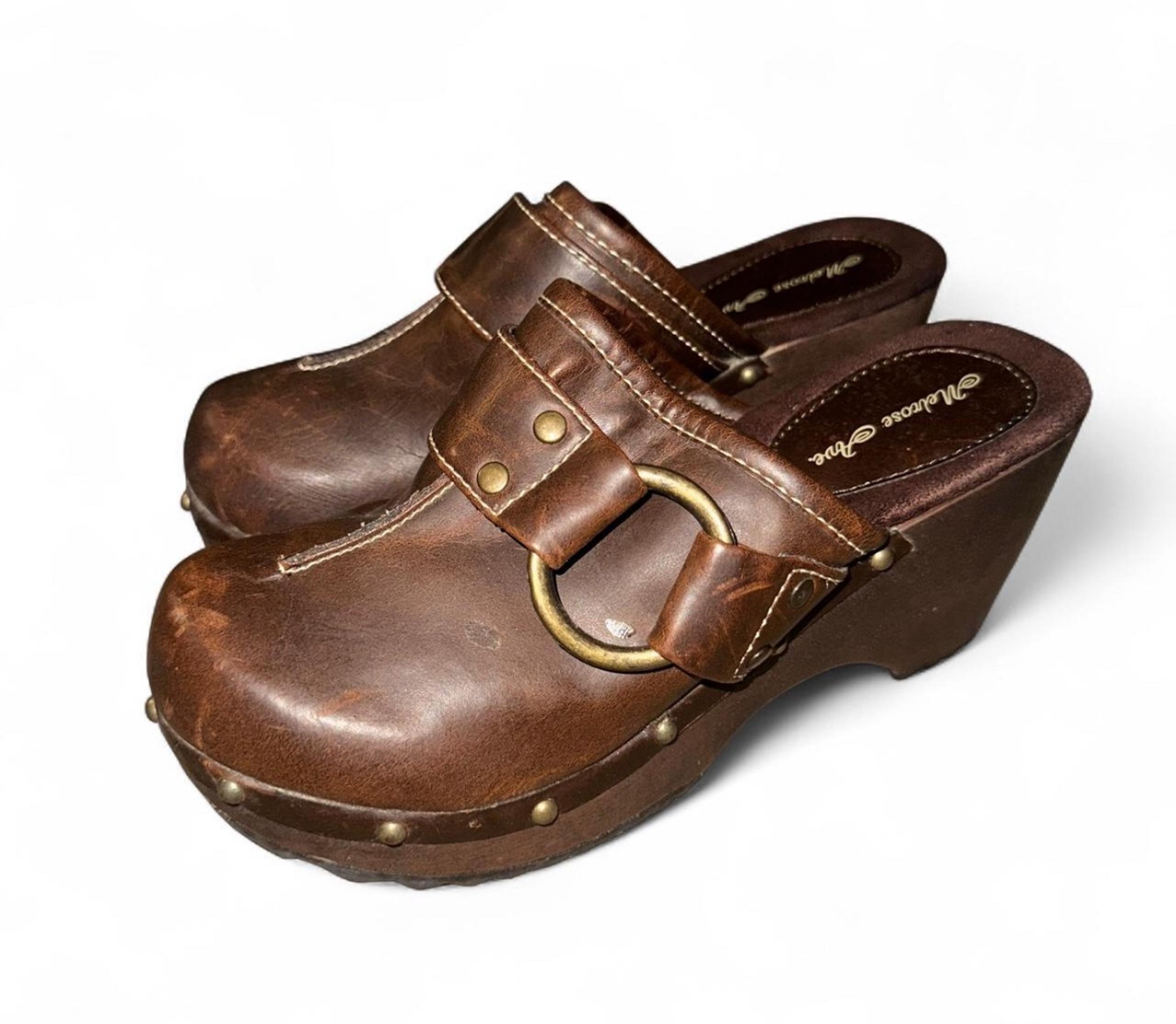 Brown leather clogs with buckle detail