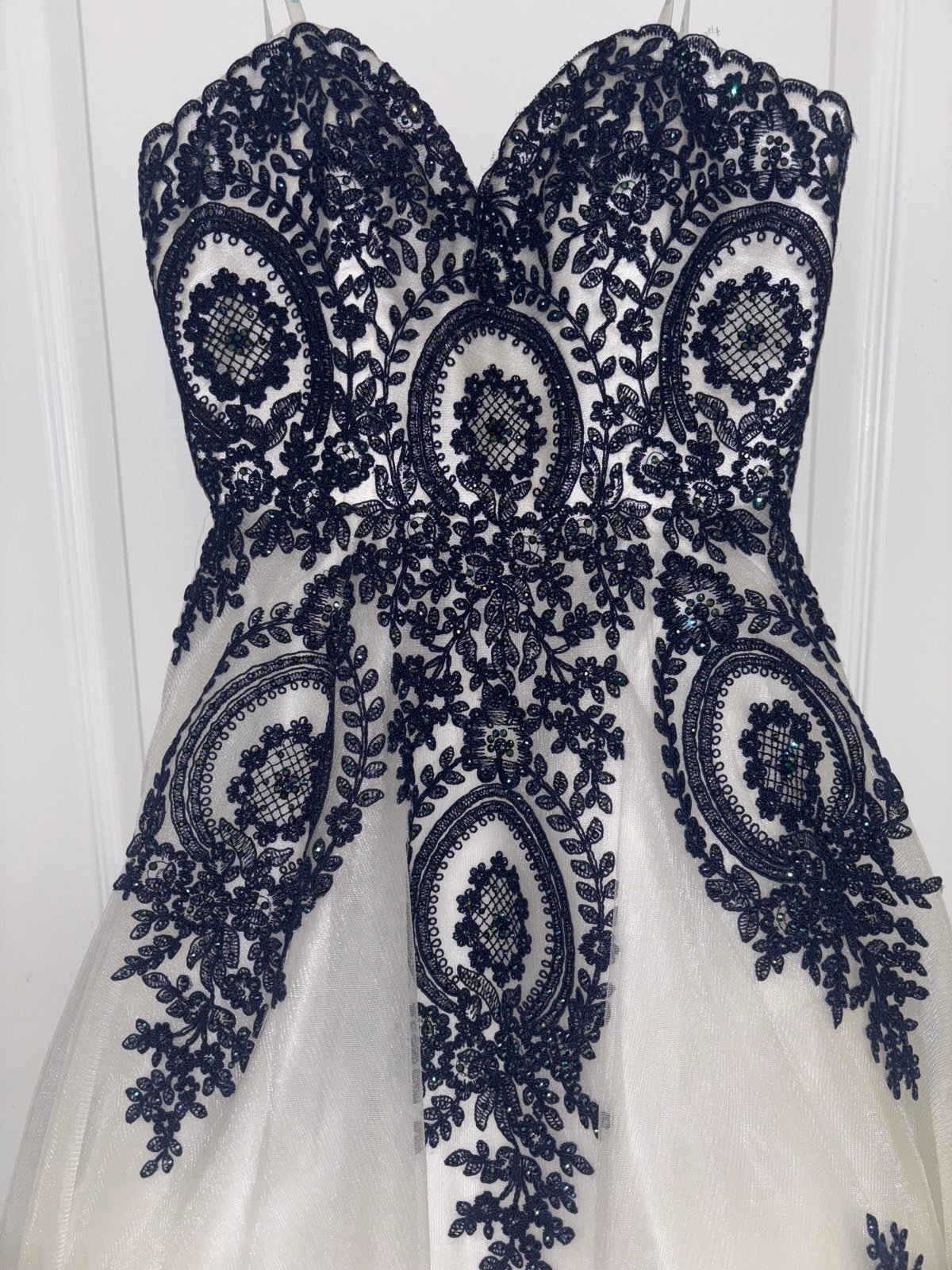 white and navy blue gown