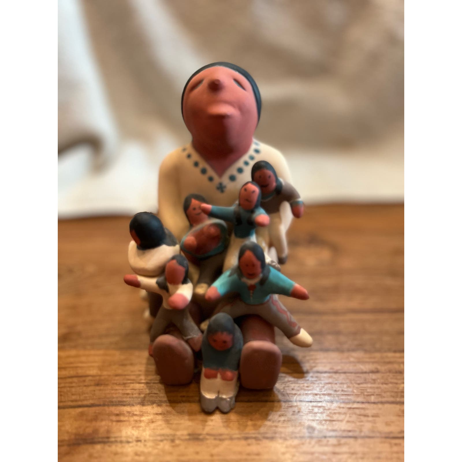 Native American statue storyteller with 7 kids