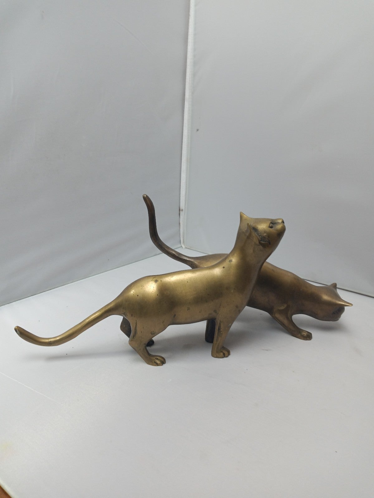 2 solid brass cats
