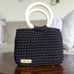 Handmade handbag with two wooden handles