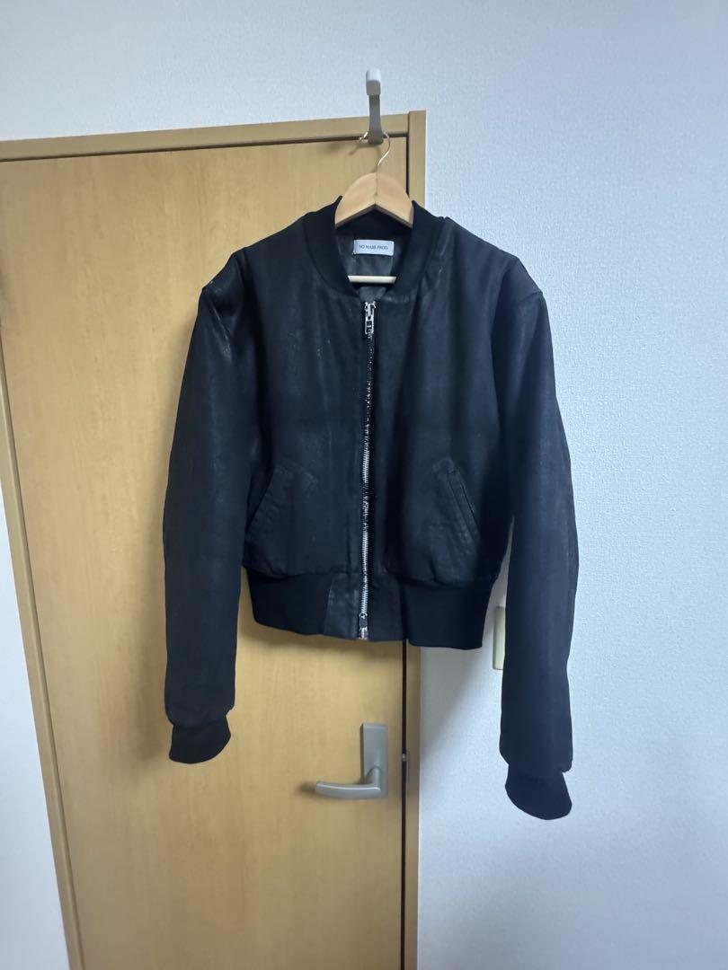 No mass-produced cropped denim flight jacket.