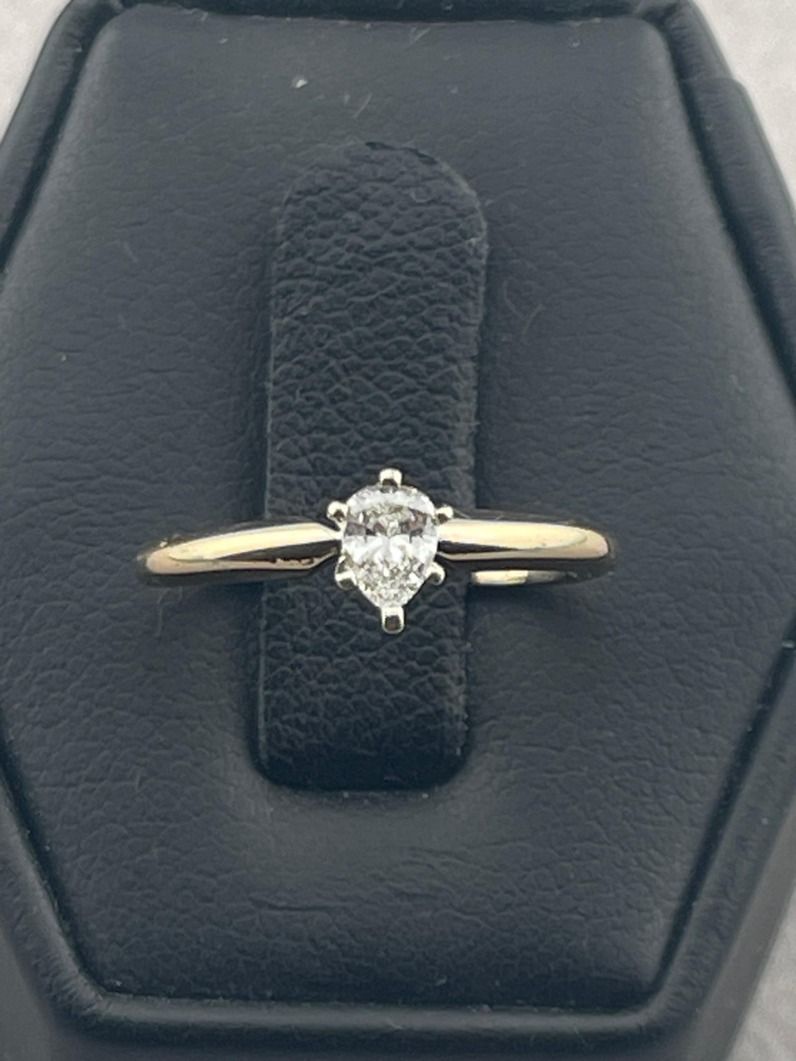 Vintage quarter carat, pear shape, diamond solitaire 14 karat yellow gold