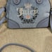Juicy couture heritage satchel slate blue color with change purse.