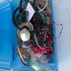 Box full of jewelry bracelets necklaces earrings
