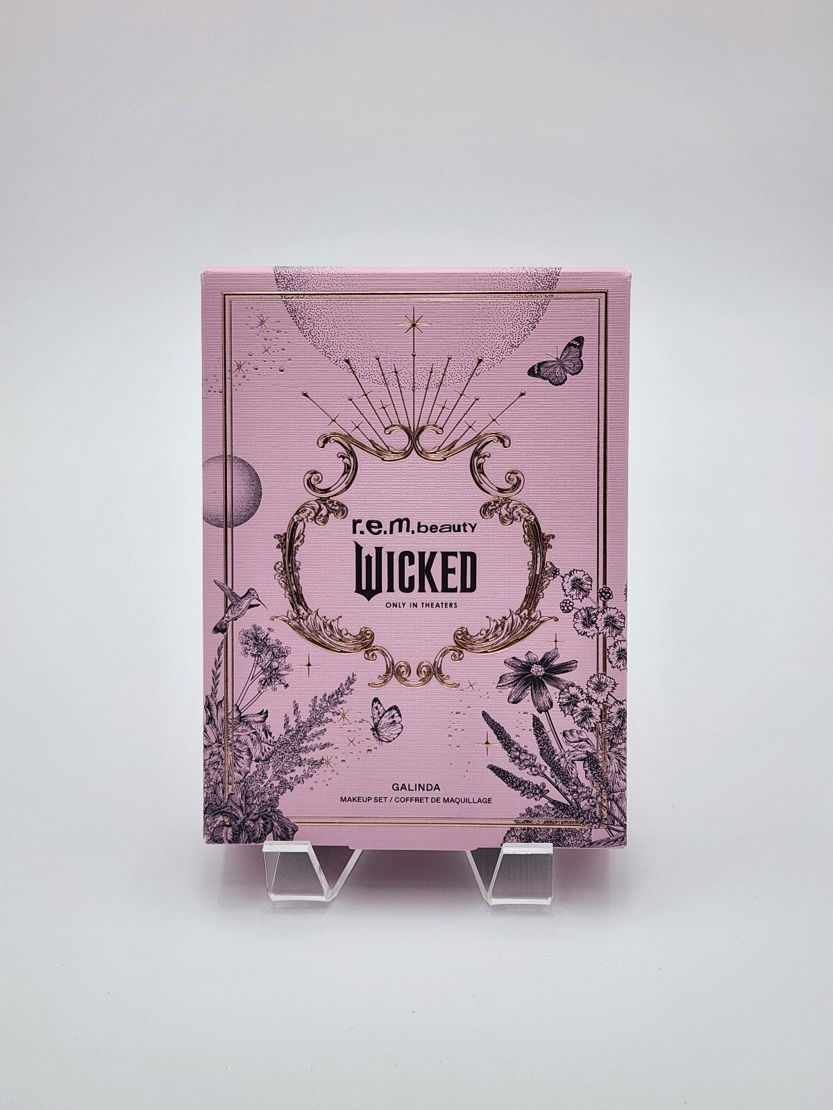 r.e.m. beauty x Wicked Galinda makeup set rem beauty in hand