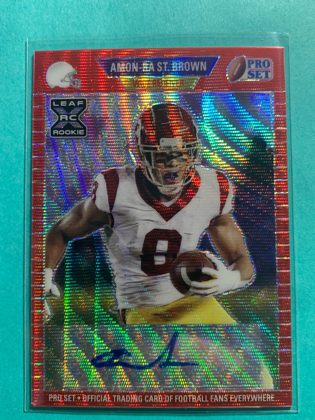 Amon-ra st brown ssp /75 rookie auto red wave