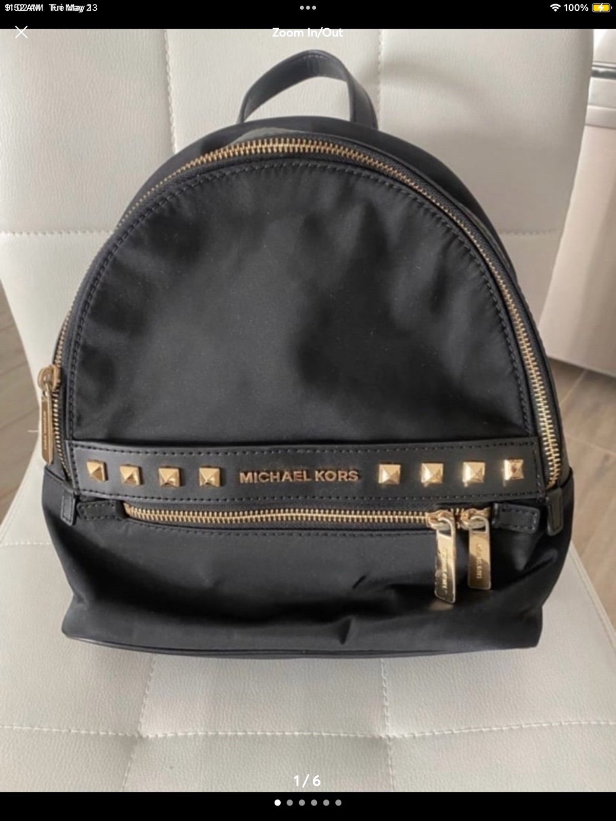 MICHEAL KORS KENLY BLACK AND GOLD MEDIUM BACKPACK