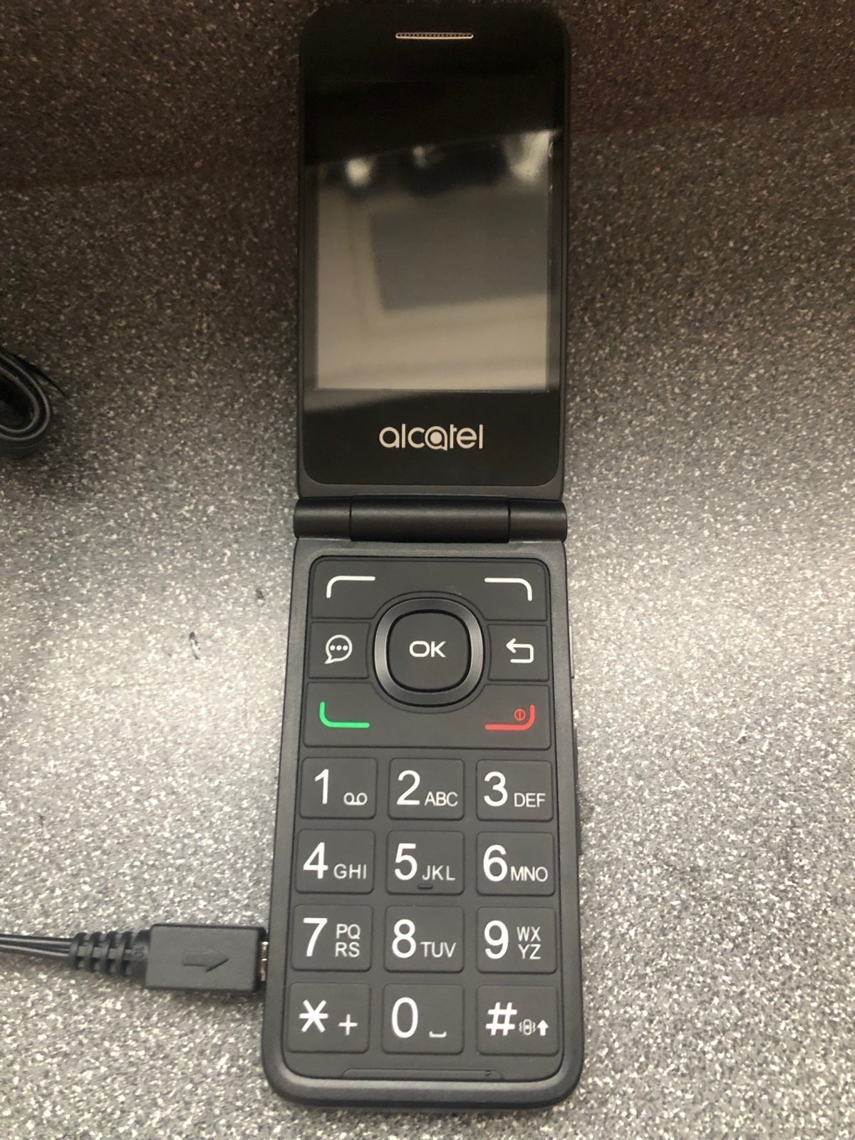 Alcatel flip phone never used with charger Sprint carrier