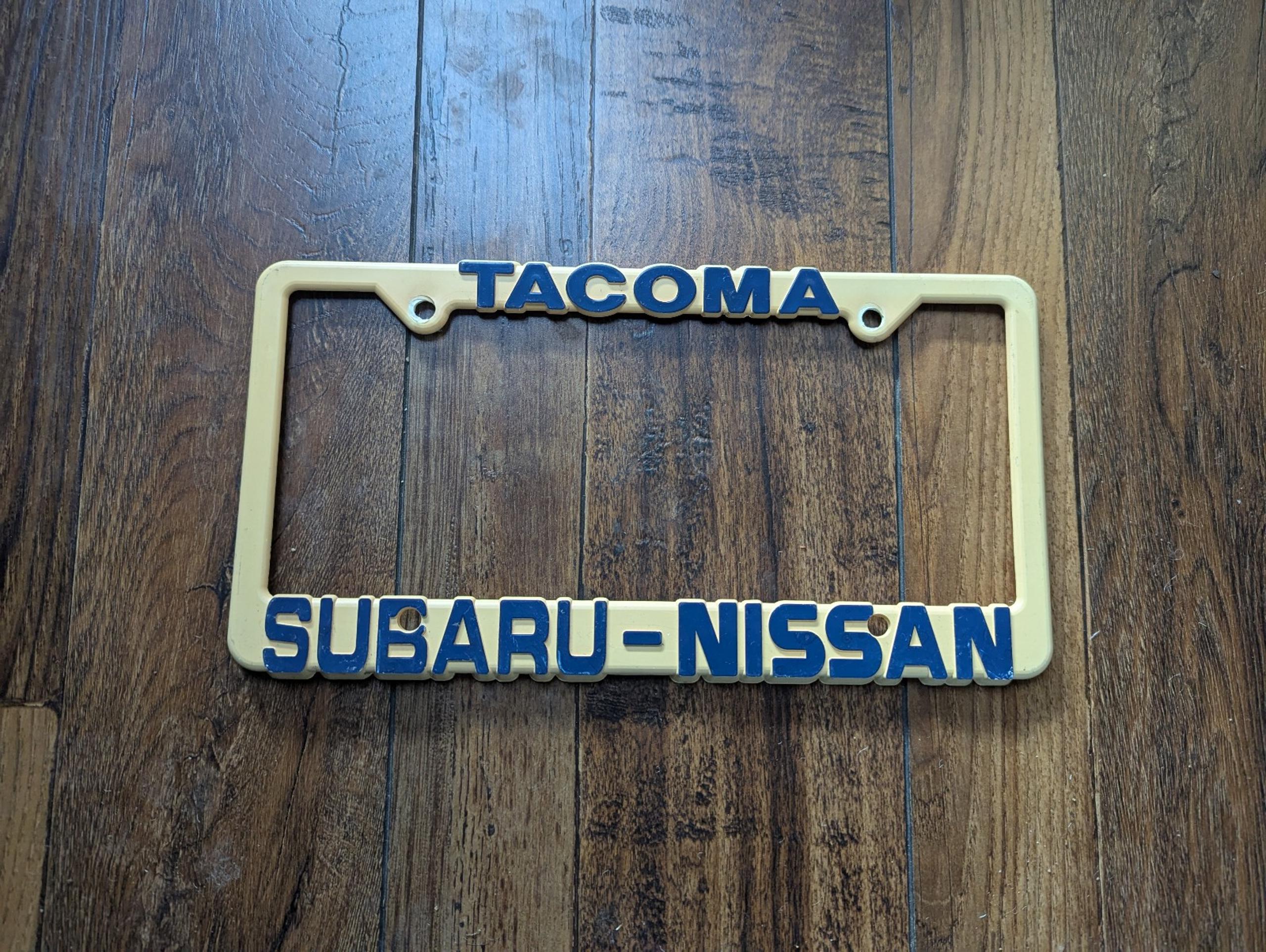 RARE Vintage Tacoma Washington Subaru Nissan Plastic Dealer License Plate Frame