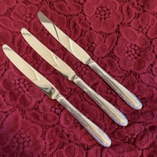 Three Sterling handle flatware dinner knives