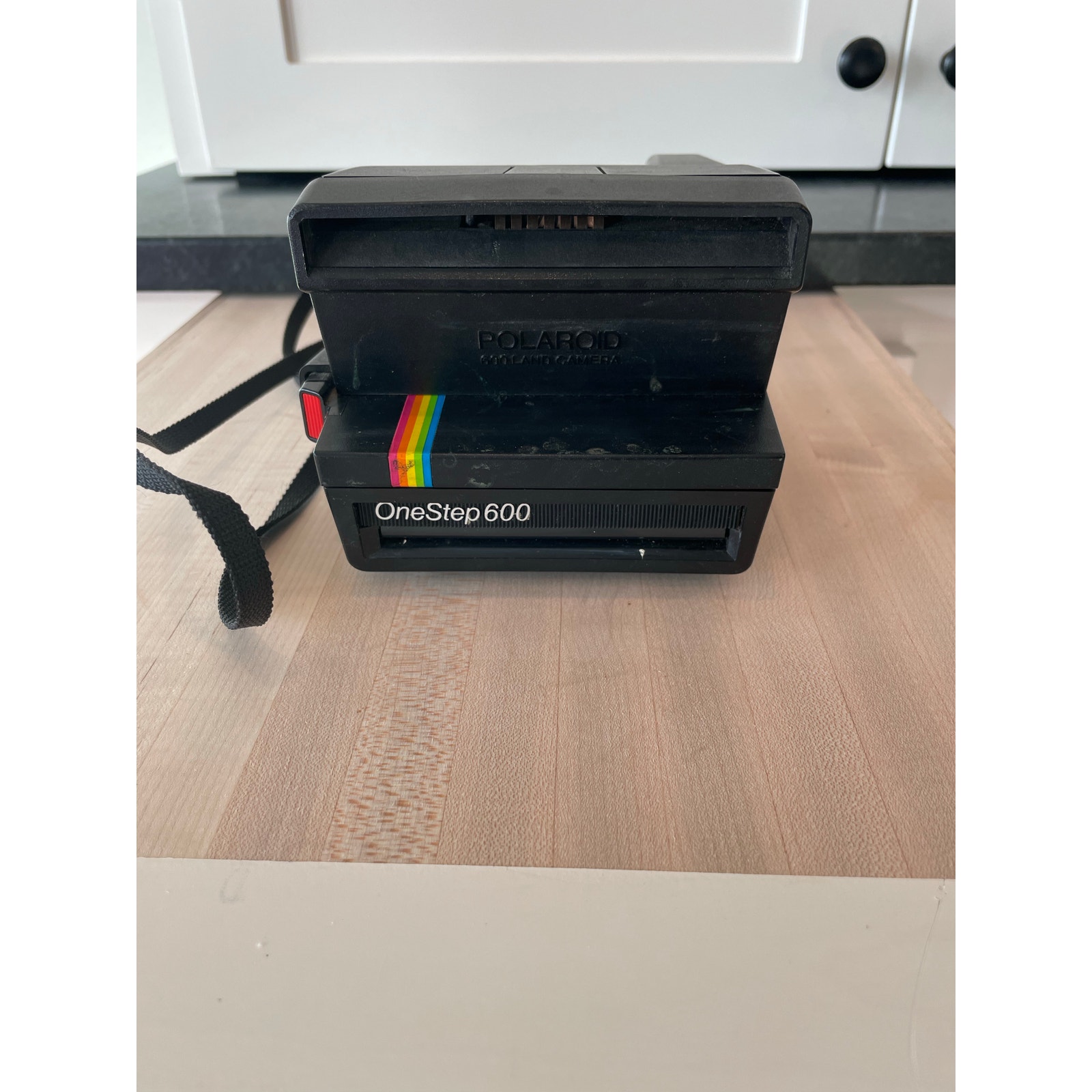 Vintage Polaroid Rainbow OneStep 600 instant film camera with strap