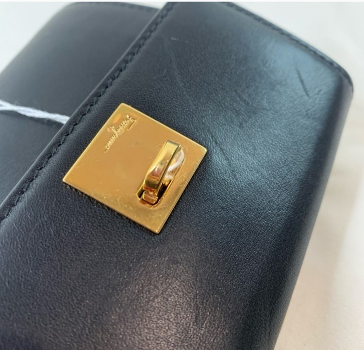 Authentic Salvatore Ferragamo Black leather trifold wallet.