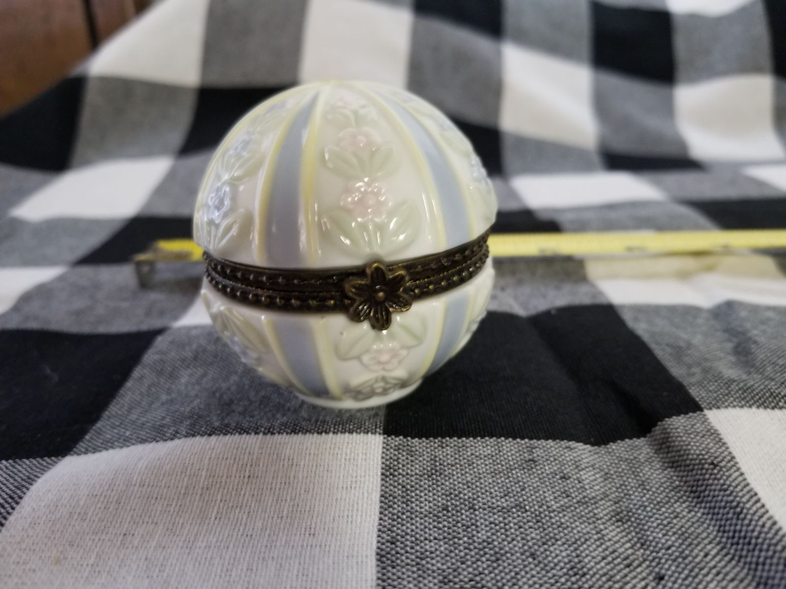 Beautiful clock in a porcelain orb