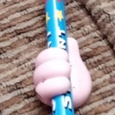 A pink thumbs up finger for your pencil
