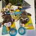 Nuby Snuggleez plush pacifier holder w/ Small Natural Flex Pacifier
