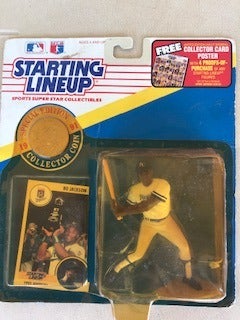 12 Starting Lineup figures with plastic display cases