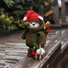 Christmas bear with a bag of gifts. Collectible, interior toy. Gift for Christma