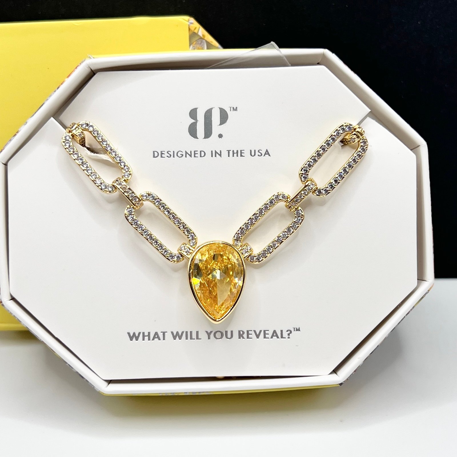 Bomb Party November Necklace Held In Flight