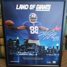 Framed poster signed by NFL New York Gia