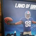 Framed poster signed by NFL New York Gia