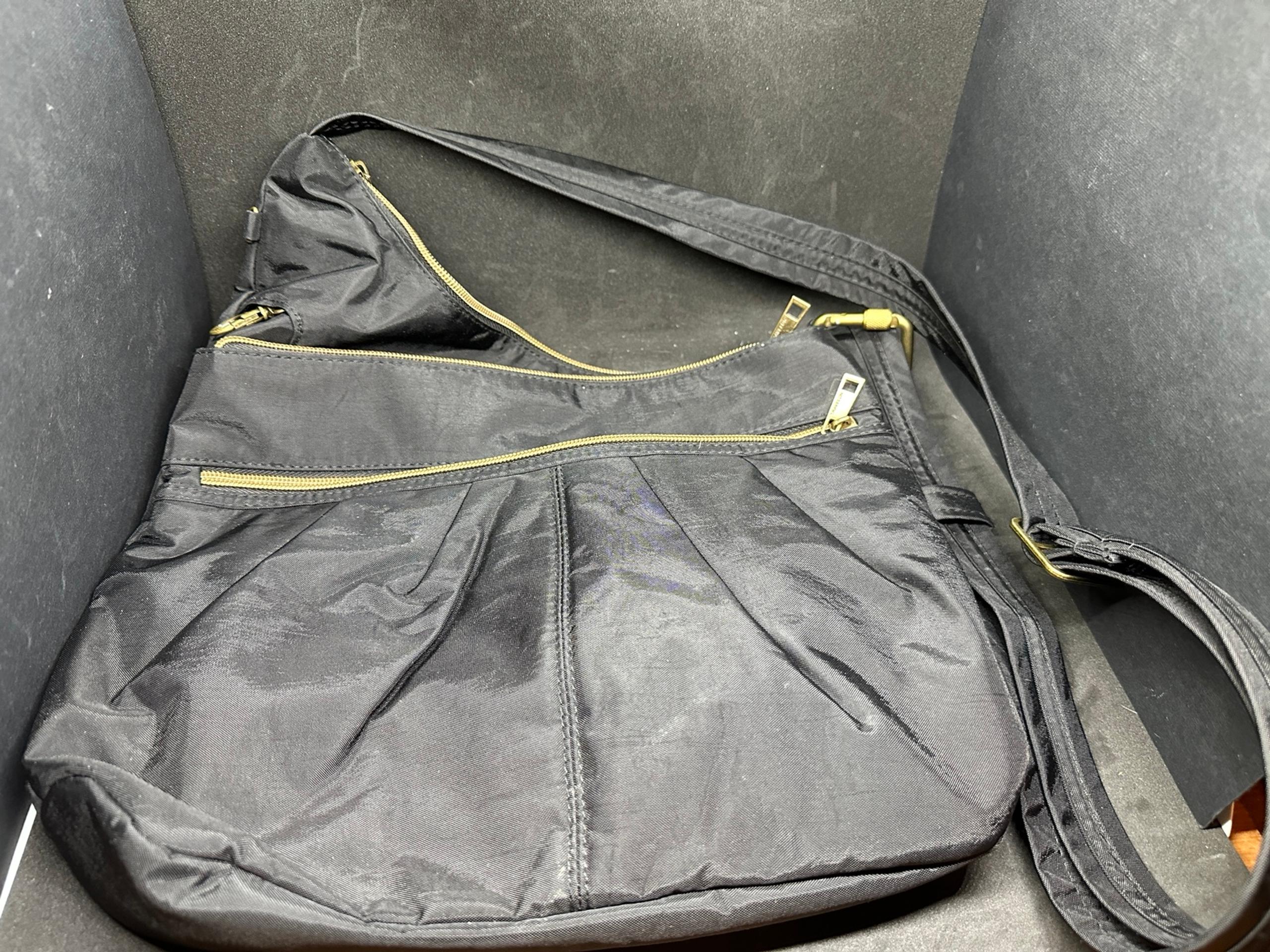 Traveling black crossbody purse
