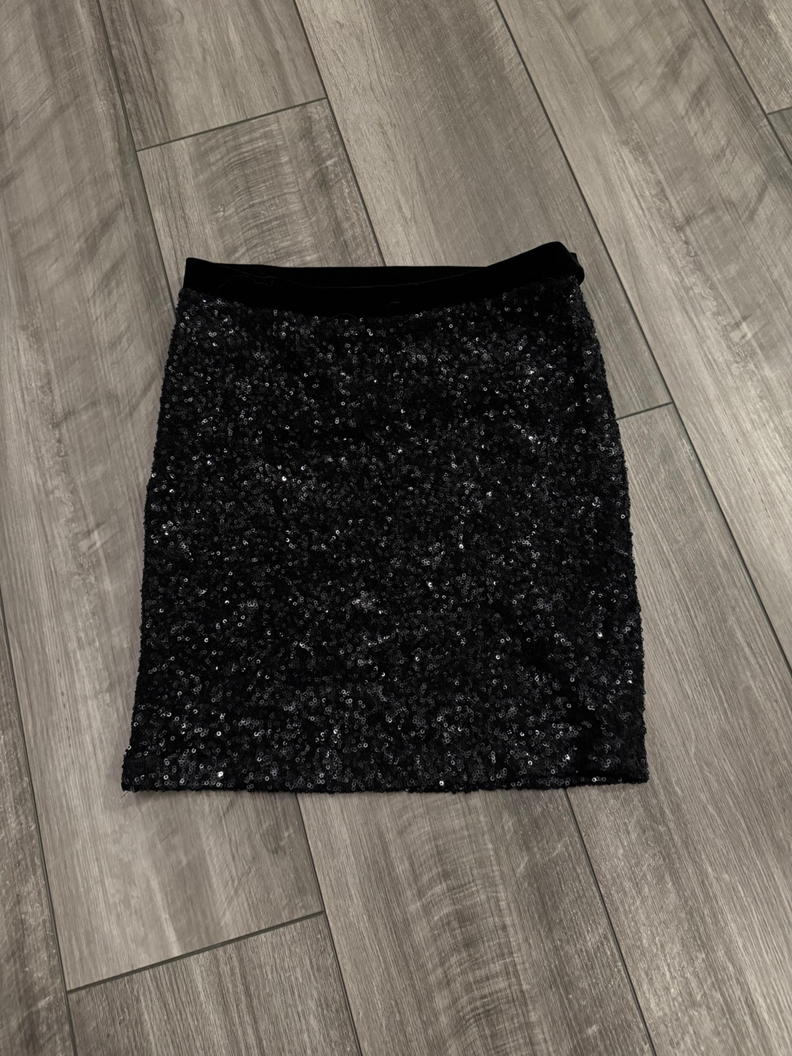 Black Bebe sequin mini skirt