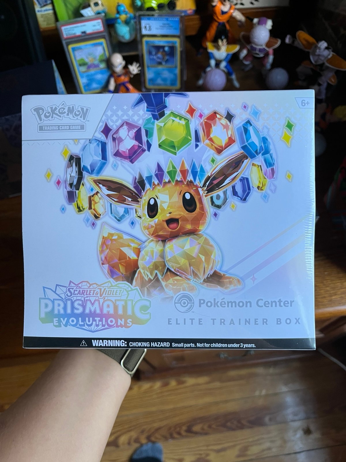 prismatic evolutions Pokemon center etb