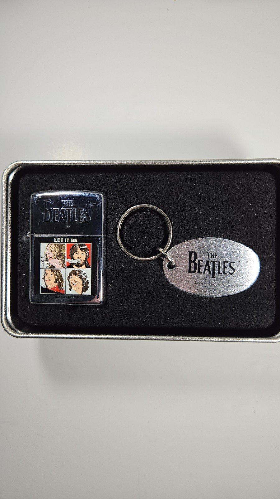Beatles ZIPPO Lighter w/key chain in original aluminum packaging. Brand new.