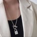 The Lock It Down Long silver necklace with lock and toggle closure