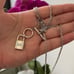 The Lock It Down Long silver necklace with lock and toggle closure