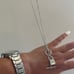 The Lock It Down Long silver necklace with lock and toggle closure