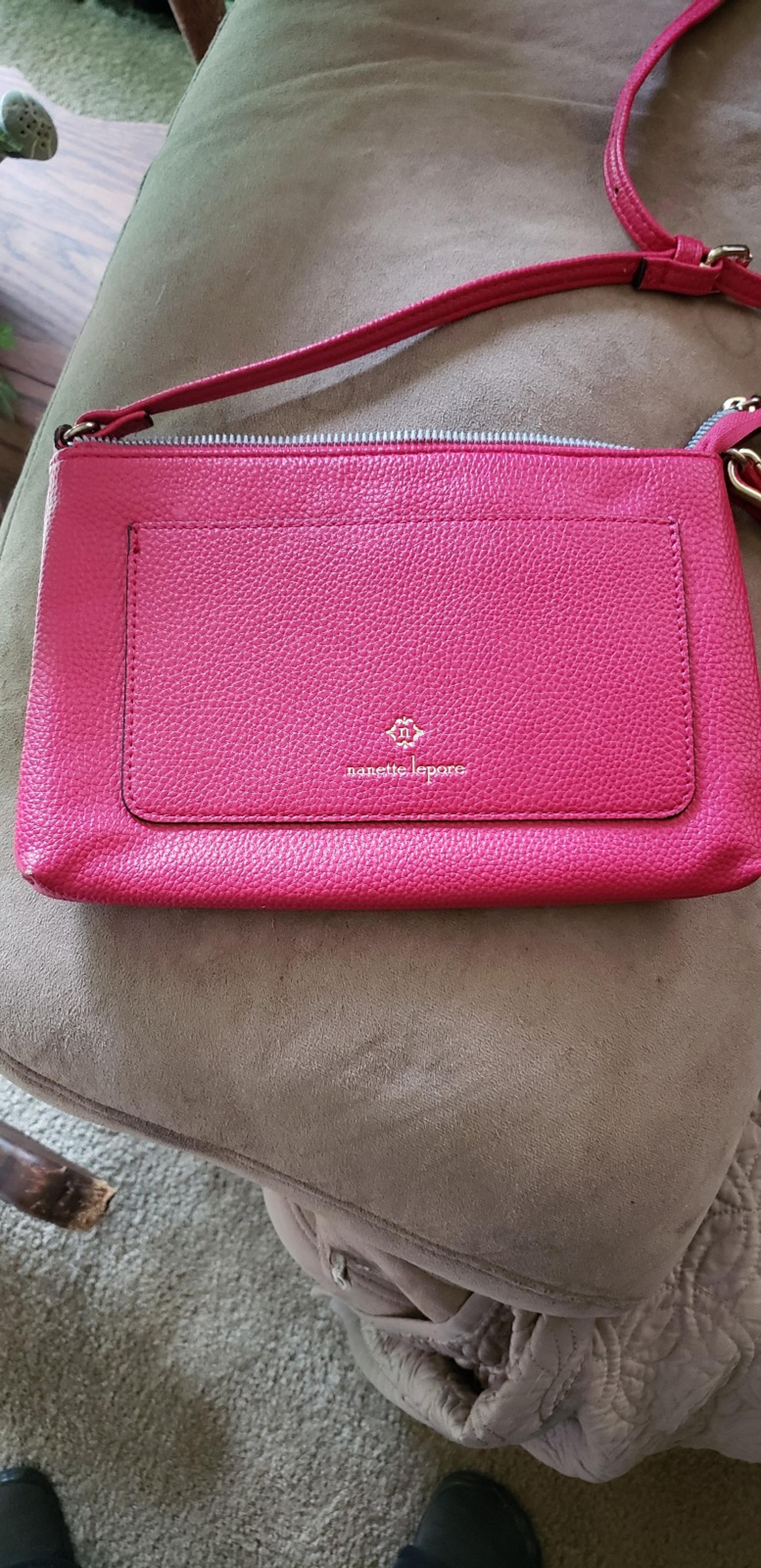 Nanette lepore cross body pink purse. Adjustable straps. Gold hardware.
