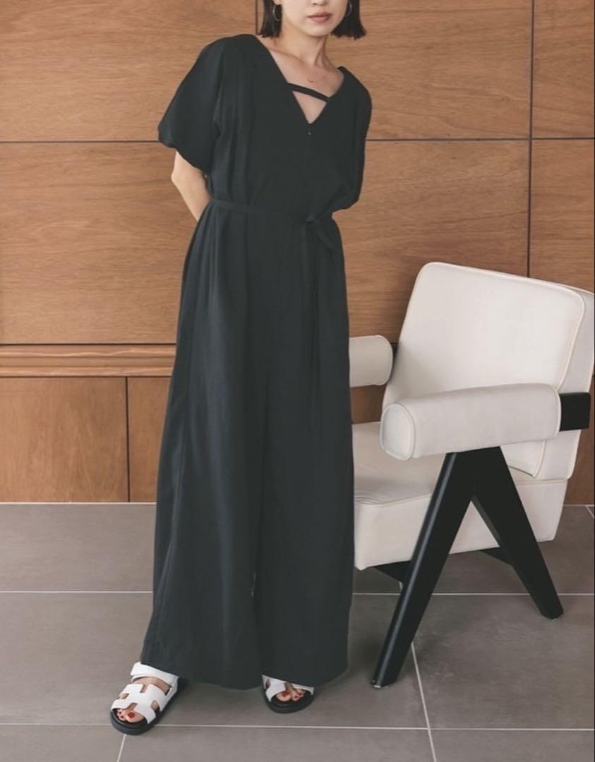 Brand new and unused!! Donovan V-neck black jumpsuit, short length.