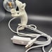 Mouse holding light bulb accent light