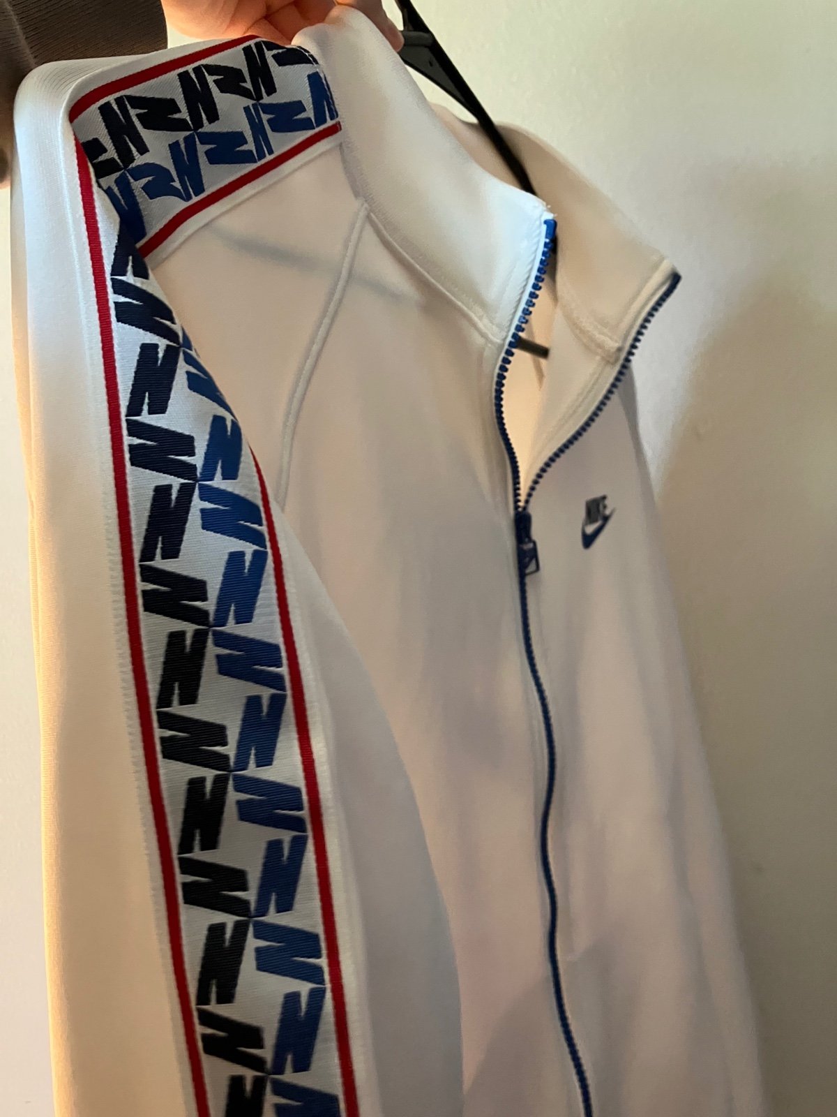 Nike Apparel , long sleeve zip up & has detailing on the sleeve down the side