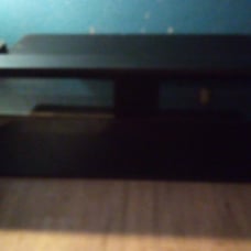 Entertainment center with glass shelf