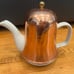 Vintage ceramic tea pot with insulated copper top in excellent condition