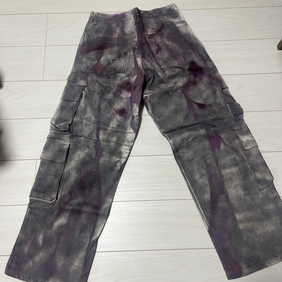 Cargo pants with a grey and purple splatter design.