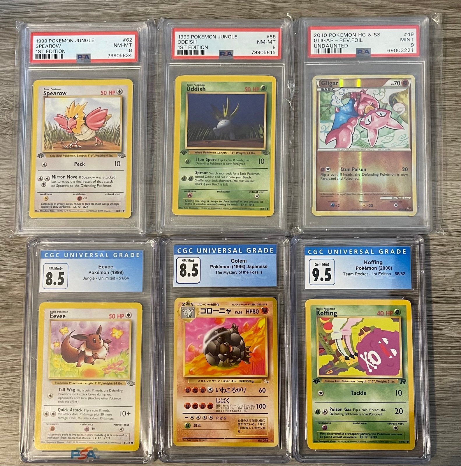 Graded Pokémon Lot x5; CGC Golem 1996 Japanese 8.5, CGC Eevee 1999 8.5, PSA 1999