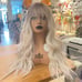 Human hair ombre platinum blonde wavy wig with bang.