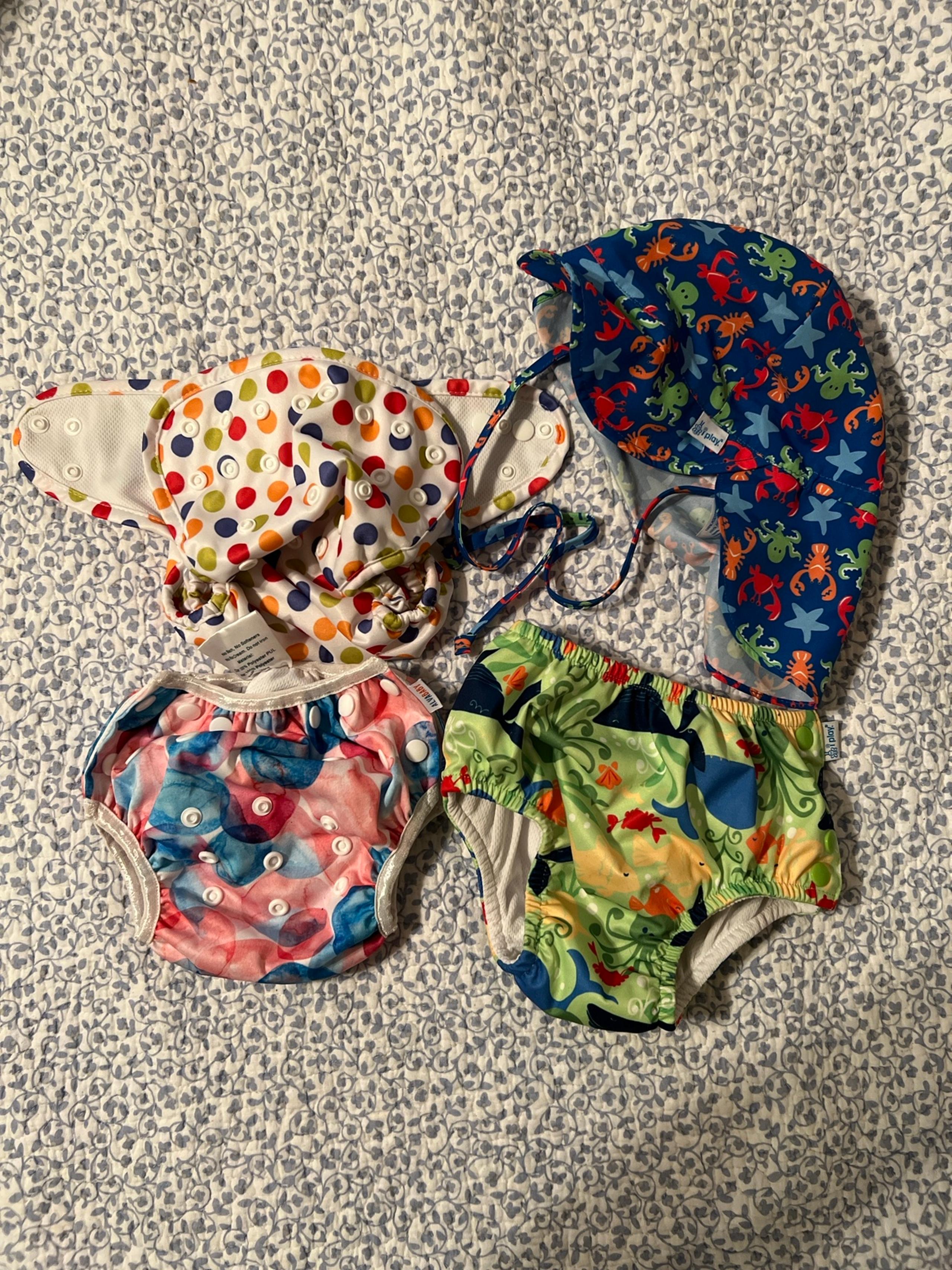 Baby swim diapers and hat lot