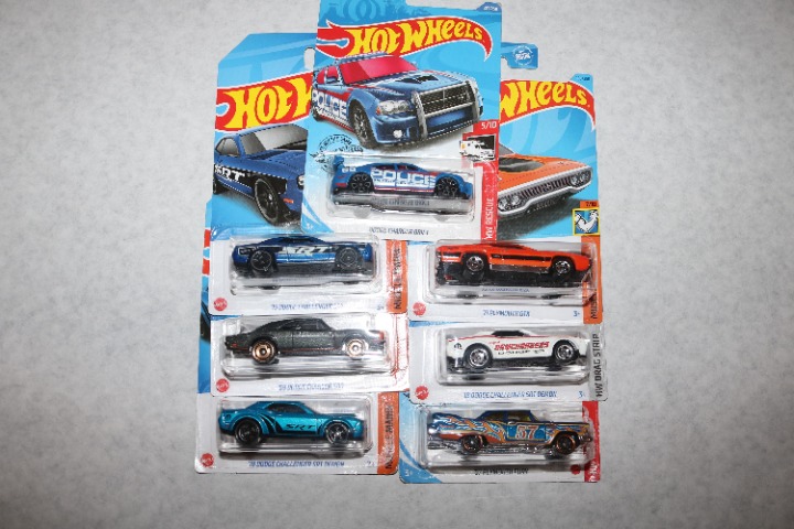 Hot Wheels lot of 7 Charger, Challenger and Plymouth all NIP 1:64 scale