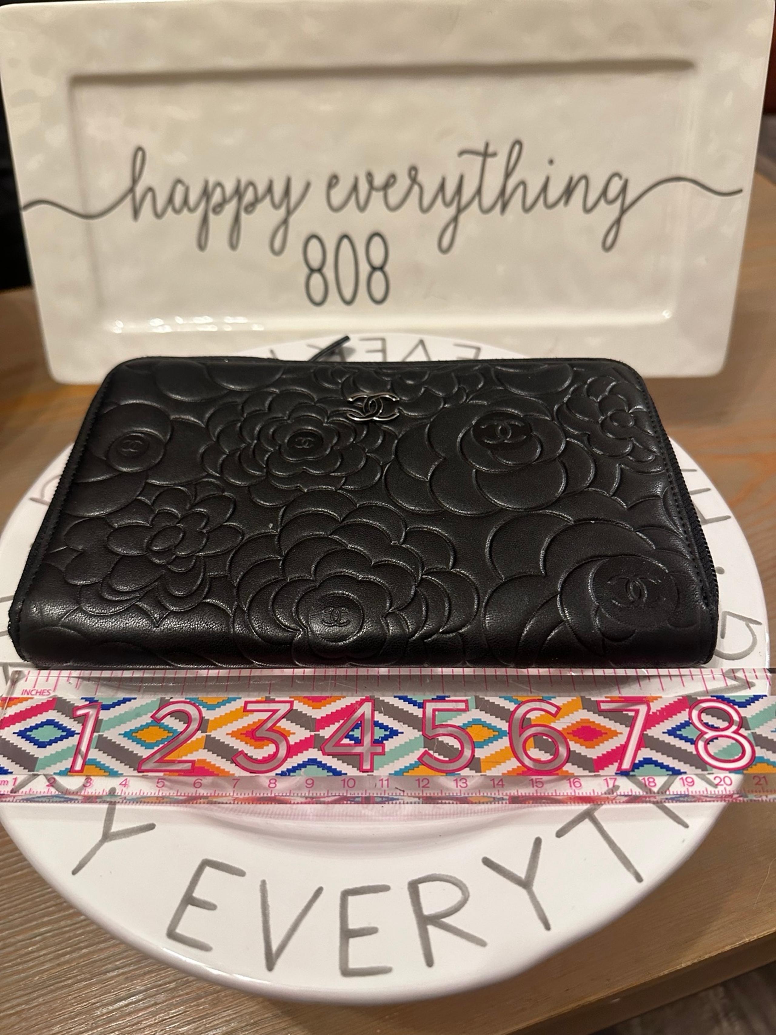 Chanel black leather camellia travel zip around wallet