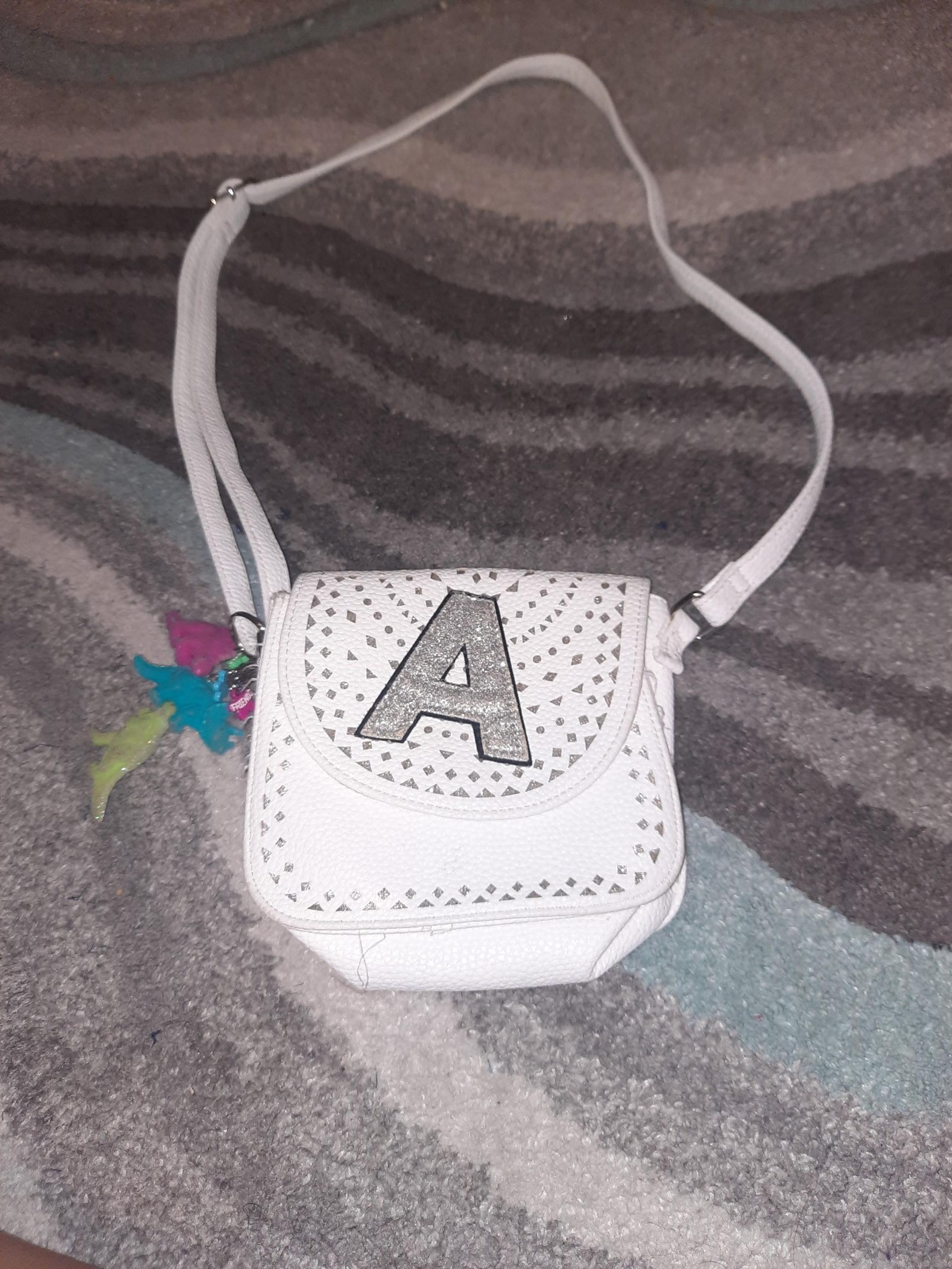 White crossbody Justice bag