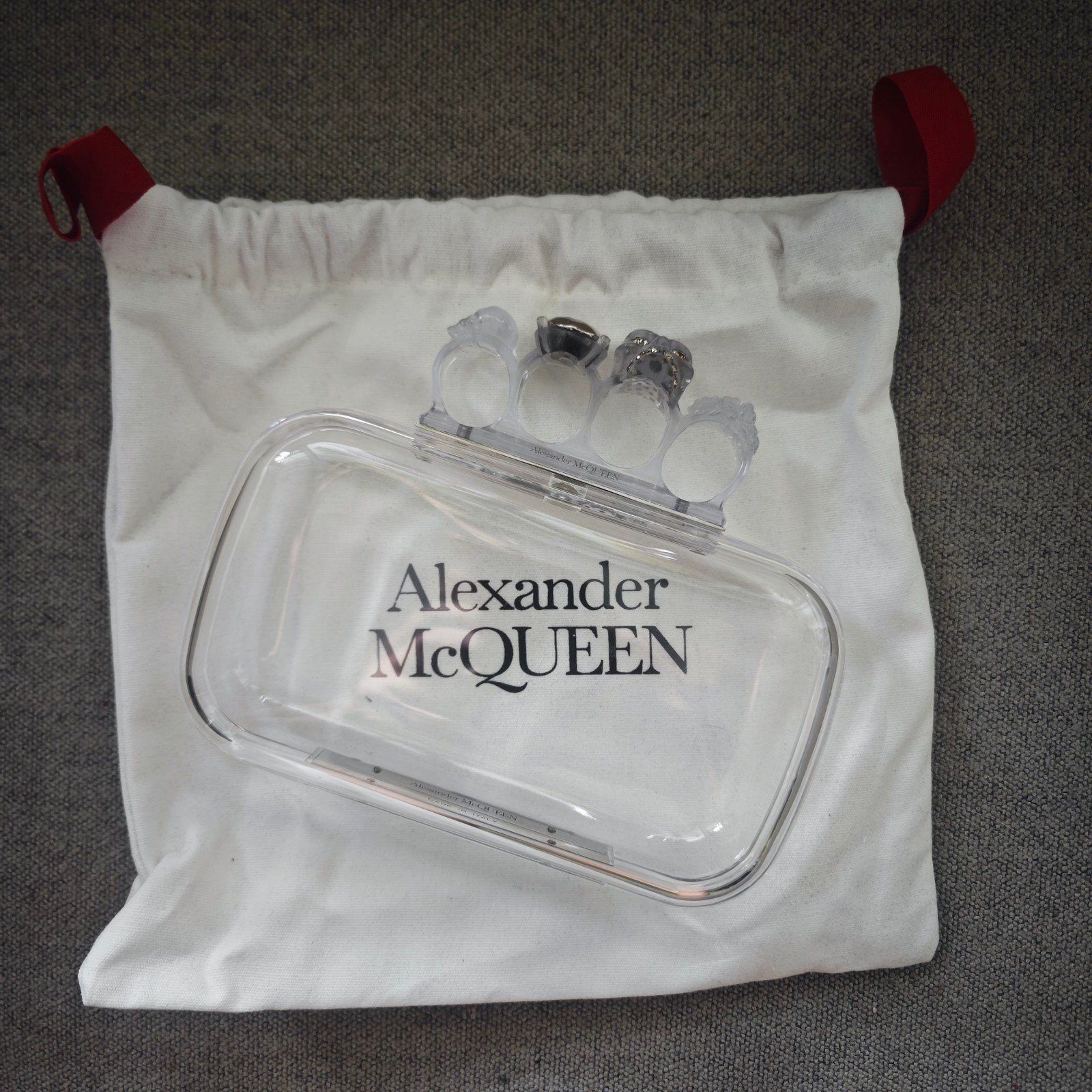 Alexander McQueen transparent knuckle duster clutch
