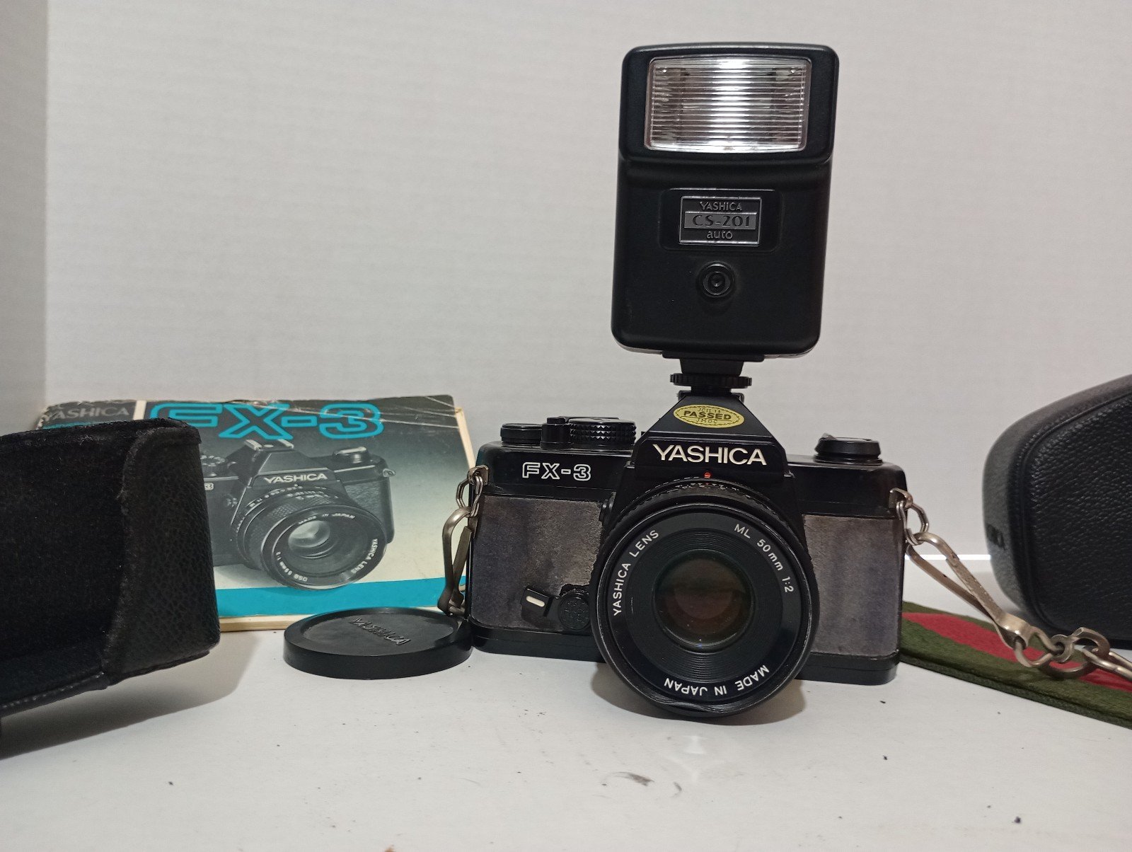 Vintage Yashica fx3 camera with 50mm lense and electronic flash unit