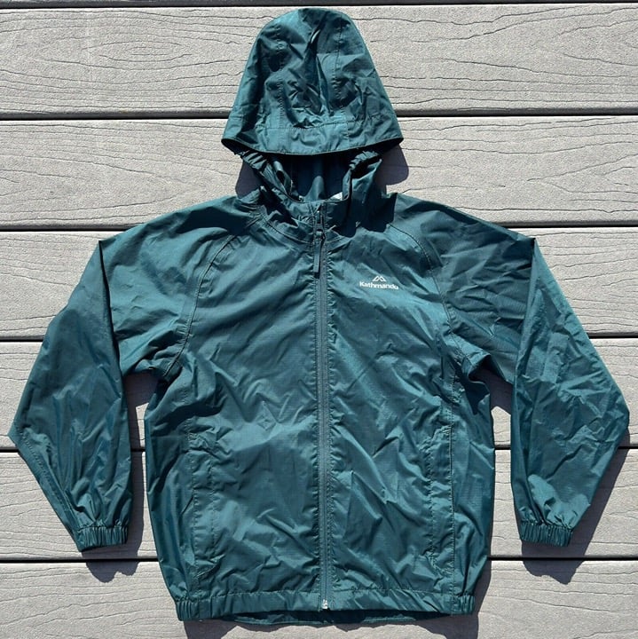 Kathmandu Pocket-It Rain Jacket Hooded Waterproof Pack & Go Kids Size Medium